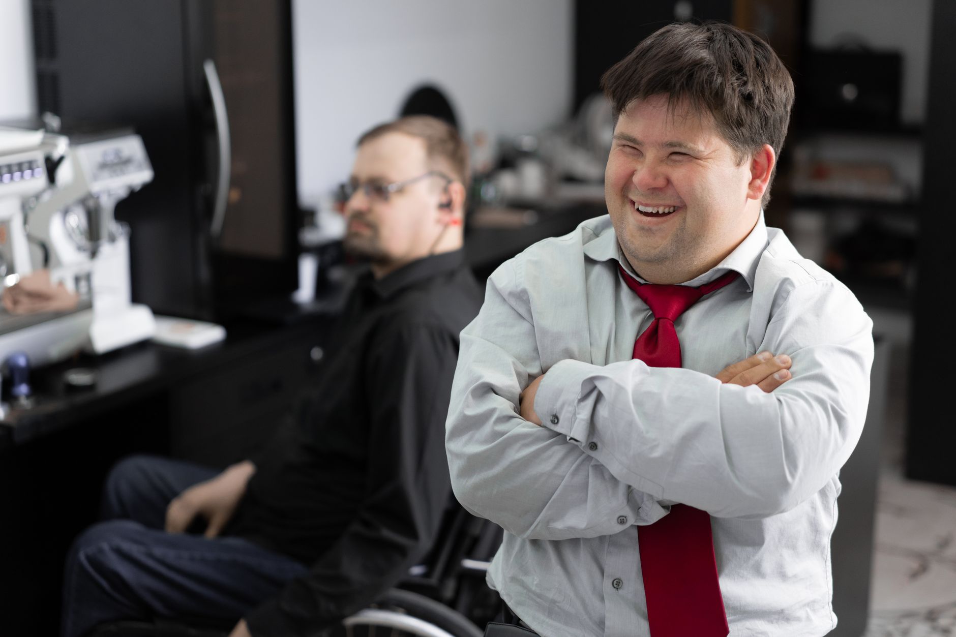 Smiling employee in office setting promoting inclusivity and diversity.